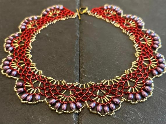 A lace collar necklace made from beads.