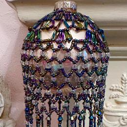 Roaring Twenties bauble. Metallic rainbow beads on a Christmas tree ornament.