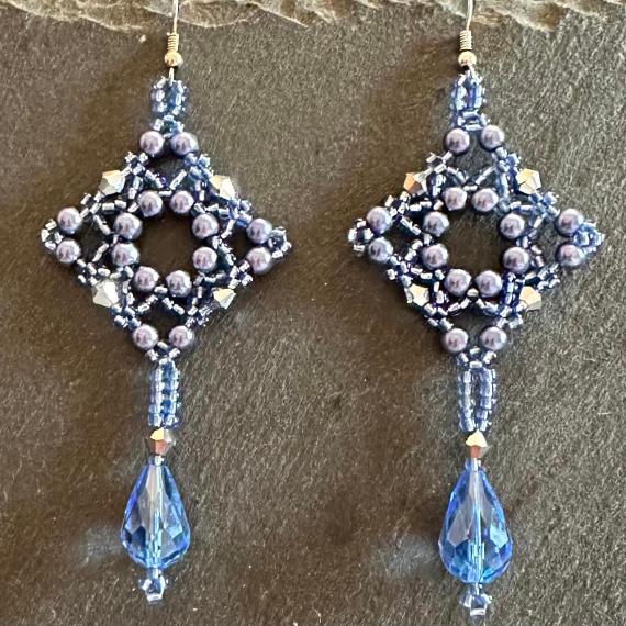 Tudor drop earrings made from pearls and crystals.